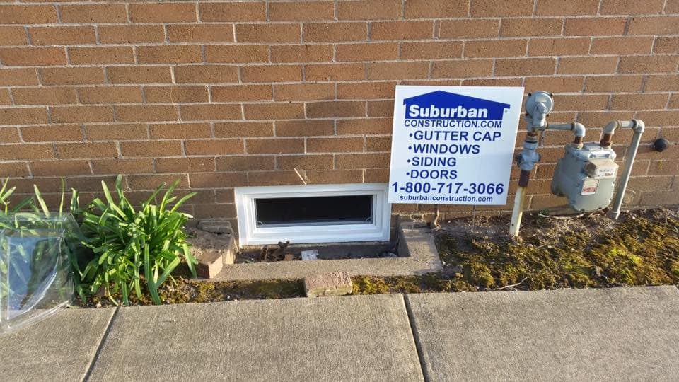 Basement replacement window installed with proper moisture sealing