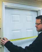 Window installation crew removing old window from home