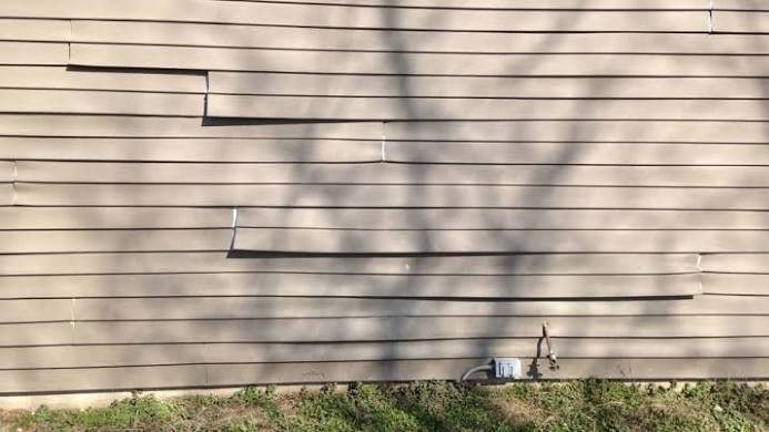 DIY Vinyl Siding Repair vs. Hiring a Professional