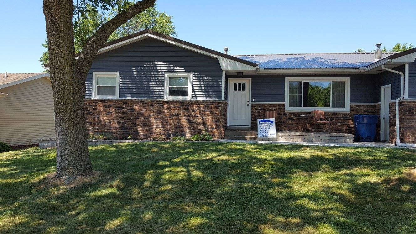 Can siding be installed around stone or brick accents?